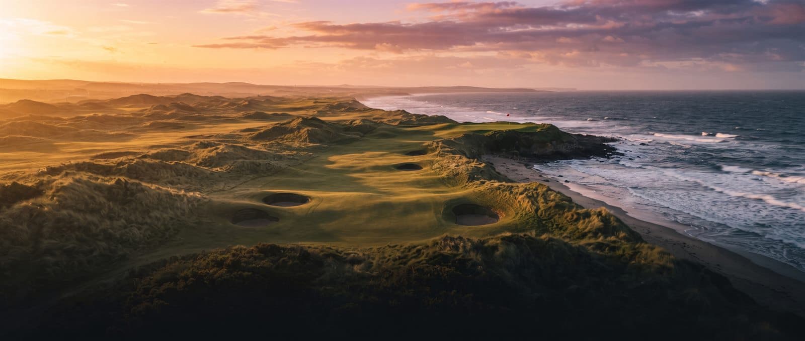 An Irish links course above the Atlantic at sunset